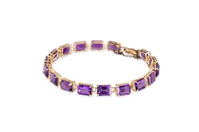 Lot 293 - A 9CT YELLOW GOLD AND AMETHYST SET BRACELET,...