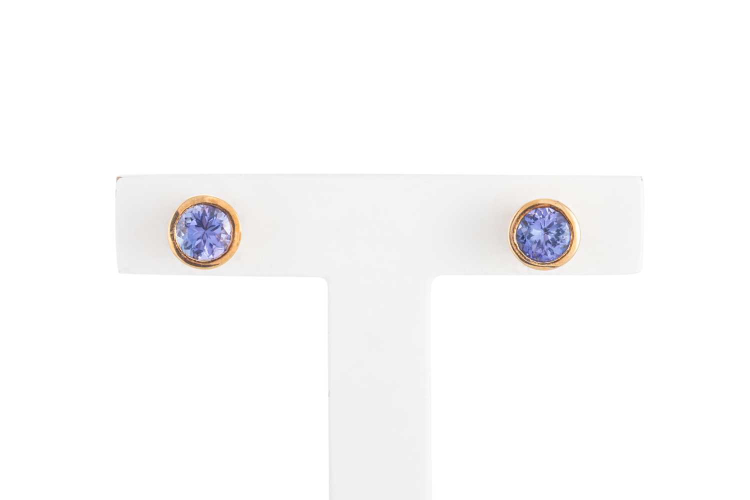 Lot 24 - A PAIR OF TANZANITE STUD EARRINGS, the round...