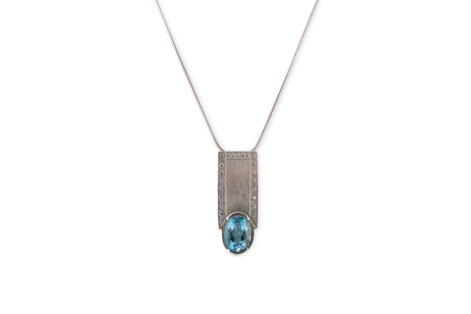 Lot 3 - A STERLING SILVER TOPAZ SET PENDANT, by Niamh...
