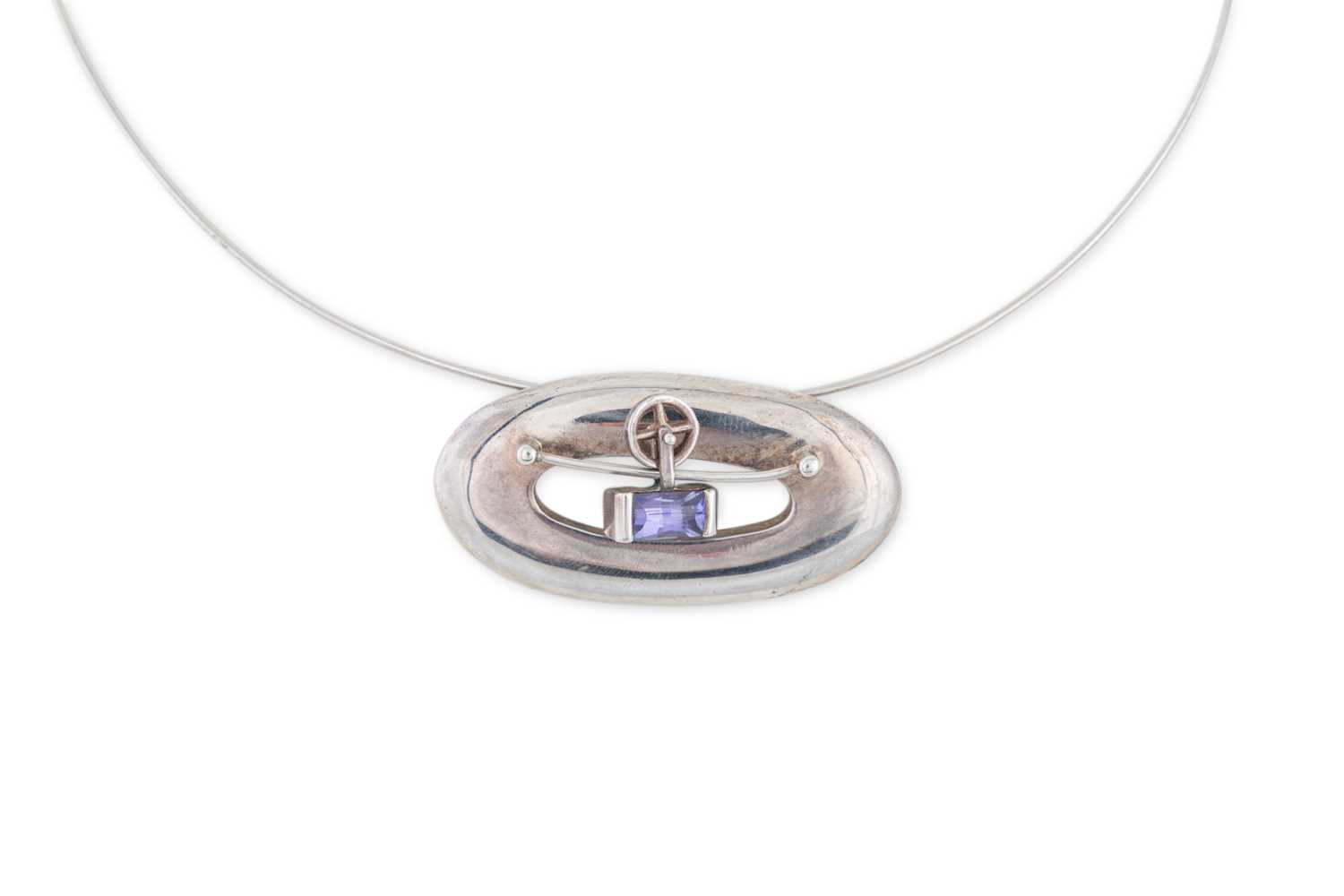 Lot 13 - A STERLING SILVER AND STONE SET PENDANT by...