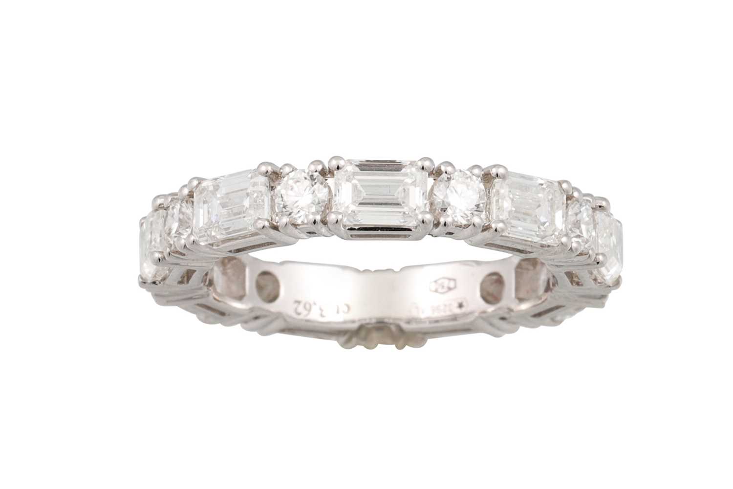 Lot 82 - A DIAMOND ETERNITY RING, set with baguette and...