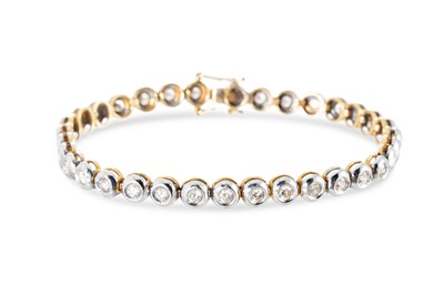 Lot 250 - A DIAMOND LINE BRACELET, the round brilliant...