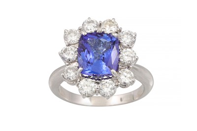 Lot 86 - A TANZANITE AND DIAMOND CLUSTER RING, the...