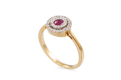 Lot 70 - A DIAMOND AND RUBY TARGET RING, the central...