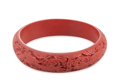 Lot 72 - AN ANTIQUE BANGLE, carved decoration, possible...