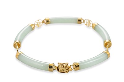 Lot 76 - A JADE SET BRACELET, mounted in 14ct yellow...