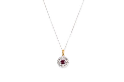Lot 82 - A DIAMOND AND RUBY PENDANT, the round ruby to...