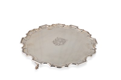 Lot 496 - A LARGE GEORGE V CIRCULAR SALVER, pie crust...