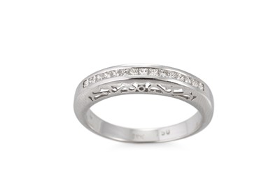 Lot 342 - A DIAMOND SET BAND RING, the princess cut...
