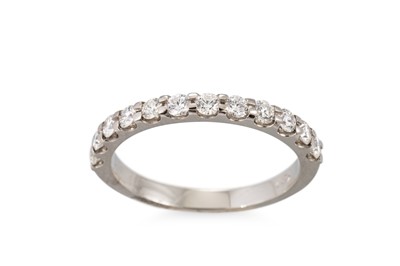 Lot 343 - A DIAMOND HALF HOOP ETERNITY RING, the round...