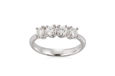 Lot 344 - A DIAMOND FOUR STONE RING, the round brilliant...