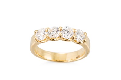 Lot 346 - A DIAMOND FOUR STONE RING, the round brilliant...