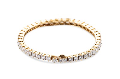 Lot 391 - A GRADUATED DIAMOND LINE BRACELET, the...