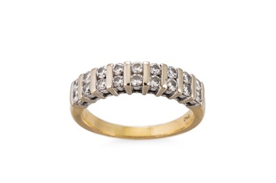 Lot 334 - A DIAMOND SET BAND RING, the round brilliant...