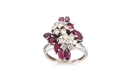 Lot 375 - A DIAMOND AND RUBY CLUSTER RING, mounted in...