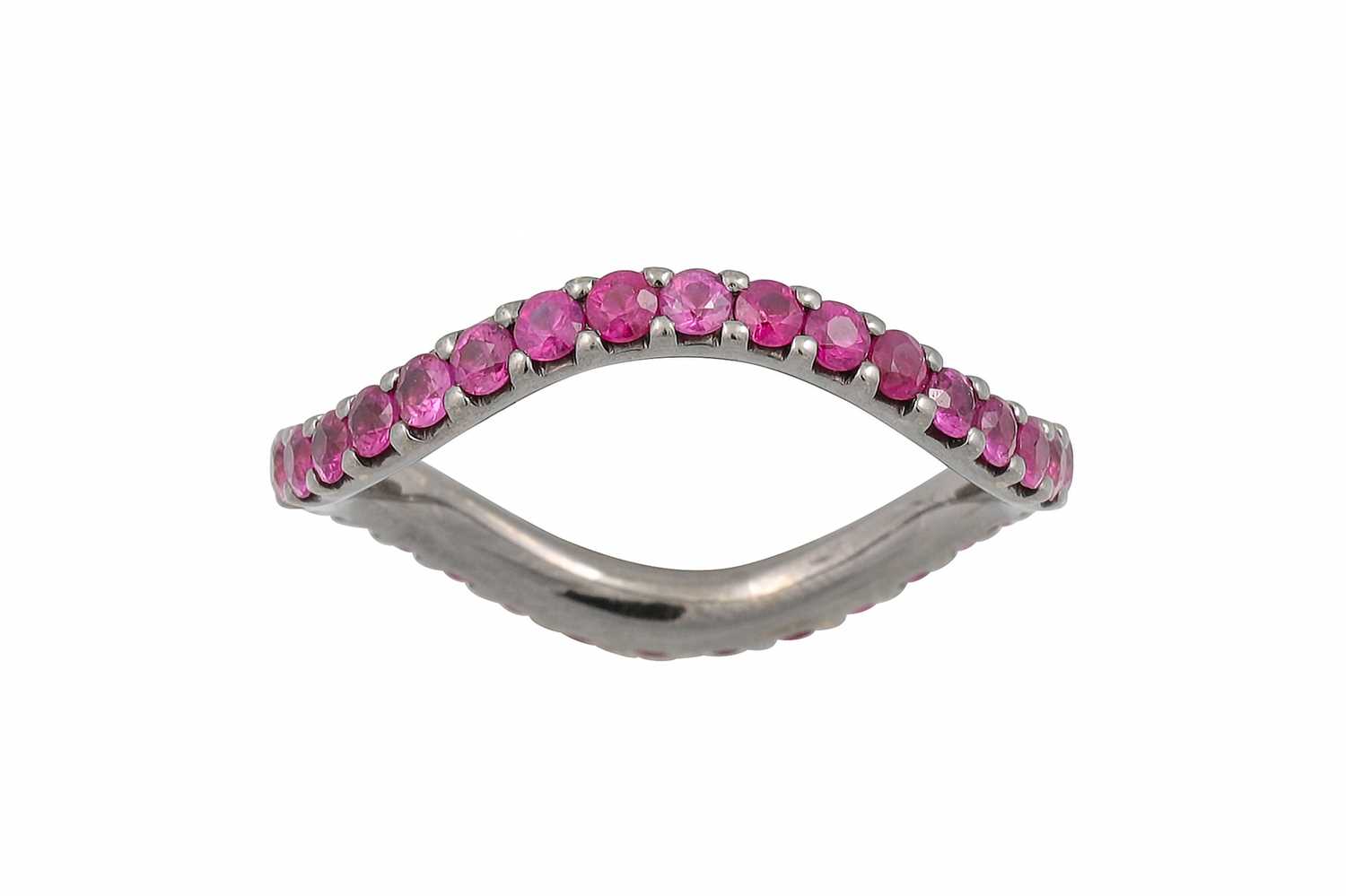 Lot 170 - A RUBY ETERNITY RING, of wavy style set with...