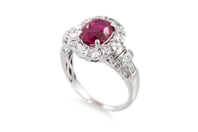 Lot 4 - A RUBY AND DIAMOND CLUSTER RING, the oval ruby...