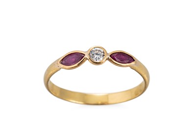 Lot 340 - A DIAMOND AND RUBY RING, the central round...