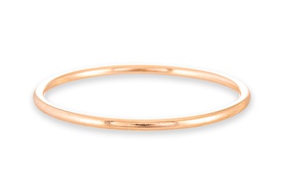 Lot 351 - A 9CT GOLD SOLID BANGLE, 32.1 g.