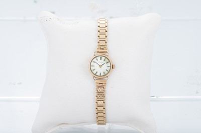 Lot 403 - A VINTAGE 9CT GOLD WATCH, with bracelet strap,...