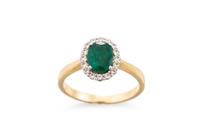 Lot 331 - AN EMERALD AND DIAMOND CLUSTER RING, the oval...