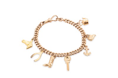 Lot 396 - A 9CT YELLOW GOLD CHARM BRACELET, seven charms...