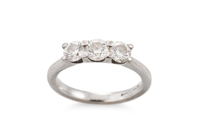 Lot 9 - A THREE STONE DIAMOND RING, mounted in 18ct...