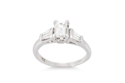 Lot 373 - A DIAMOND RING, the emerald cut diamond to...
