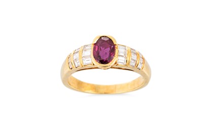 Lot 156 - A RUBY AND DIAMOND RING, the oval ruby to...