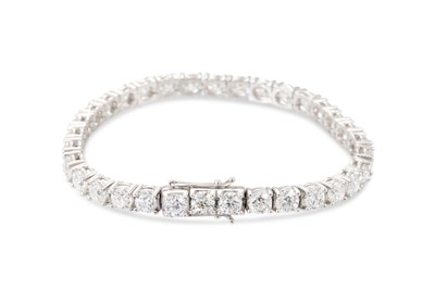 Lot 393 - A DIAMOND LINE BRACELET, the brilliant cut...