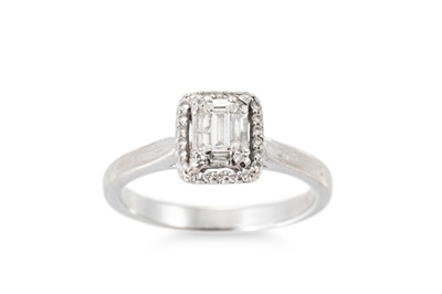 Lot 315 - A DIAMOND CLUSTER RING, the baguette and round...