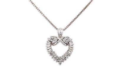 Lot 74 - A HEART SHAPED DIAMOND SET PENDANT, the...