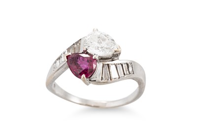 Lot 75 - A DIAMOND AND RUBY RING, of cross over design,...