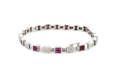 Lot 76 - A RUBY AND DIAMOND BRACELET, of square cluster...