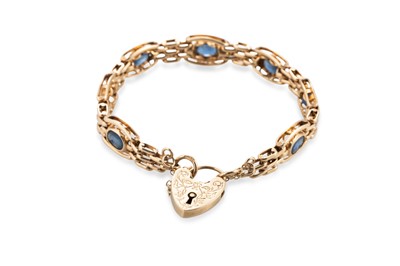 Lot 421 - A 9CT GOLD STONE SET BRACELET, with padlock...