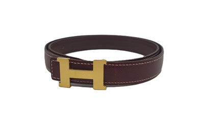 Lot 522 - A LADY'S HERMÉS LEATHER BELT, yellow tone "H"...