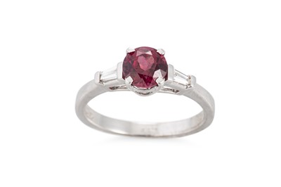 Lot 178 - A GARNET AND DIAMOND RING, the circular garnet...