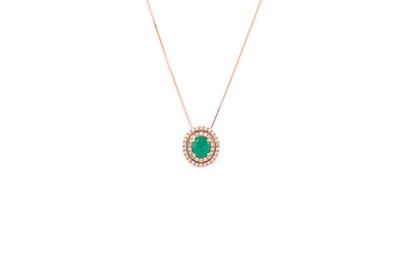 Lot 268 - AN EMERALD AND DIAMOND PENDANT, the oval...