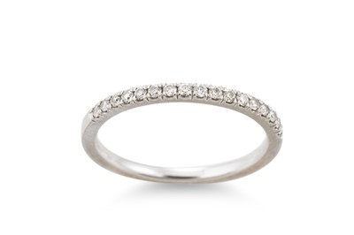 Lot 44 - A DIAMOND HALF HOOP RING, the round brilliant...