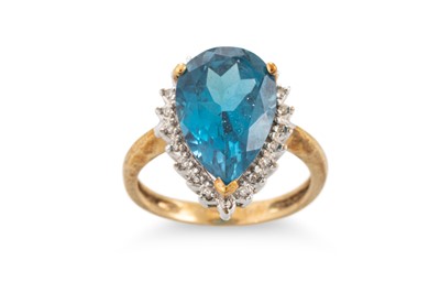 Lot 167 - A TOPAZ RING, the pear shaped topaz mounted in...