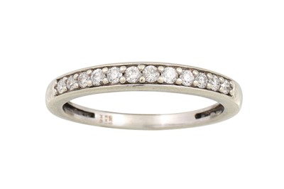 Lot 195 - A DIAMOND ETERNITY RING, mounted in 9ct white...