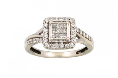 Lot 196 - A DIAMOND CLUSTER RING, set with princess and...