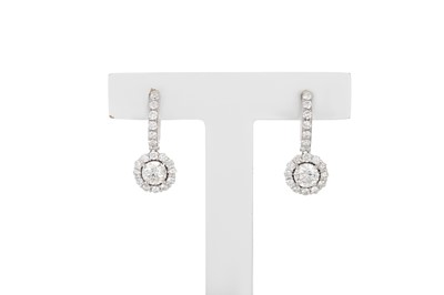 Lot 68 - A PAIR OF DIAMOND DROP EARRINGS, the round...