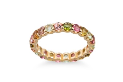 Lot 409 - A MULTI COLOURED SAPPHIRE SET ETERNITY RING,...