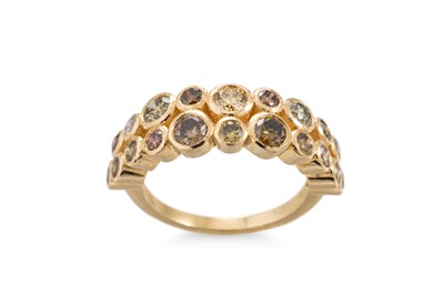 Lot 410 - A DIAMOND BAND RING, set with a double row of...