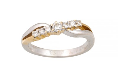Lot 201 - A DIAMOND RING OF CROSSOVER DESIGN, mounted in...