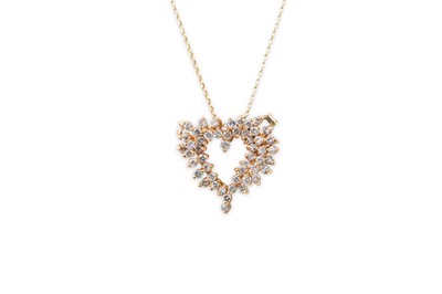 Lot 156 - A DIAMOND SET HEART SHAPED PENDANT, mounted in...