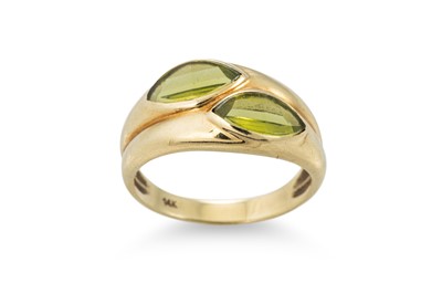 Lot 158 - A PERIDOT CROSS OVER RING, the marquise cut...