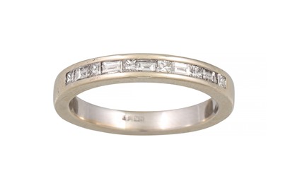 Lot 206 - A DIAMOND HALF ETERNITY RING, channel set with...