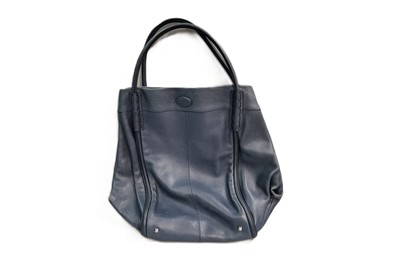 Lot 470 - A TOD'S HOBO STYLE HANDBAG, navy leather with...